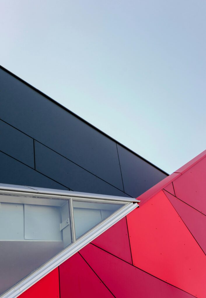 pexels-photo-1029611-1029611 A low-angle view of a modern geometric building facade with bold colors in London, ON, Canada.